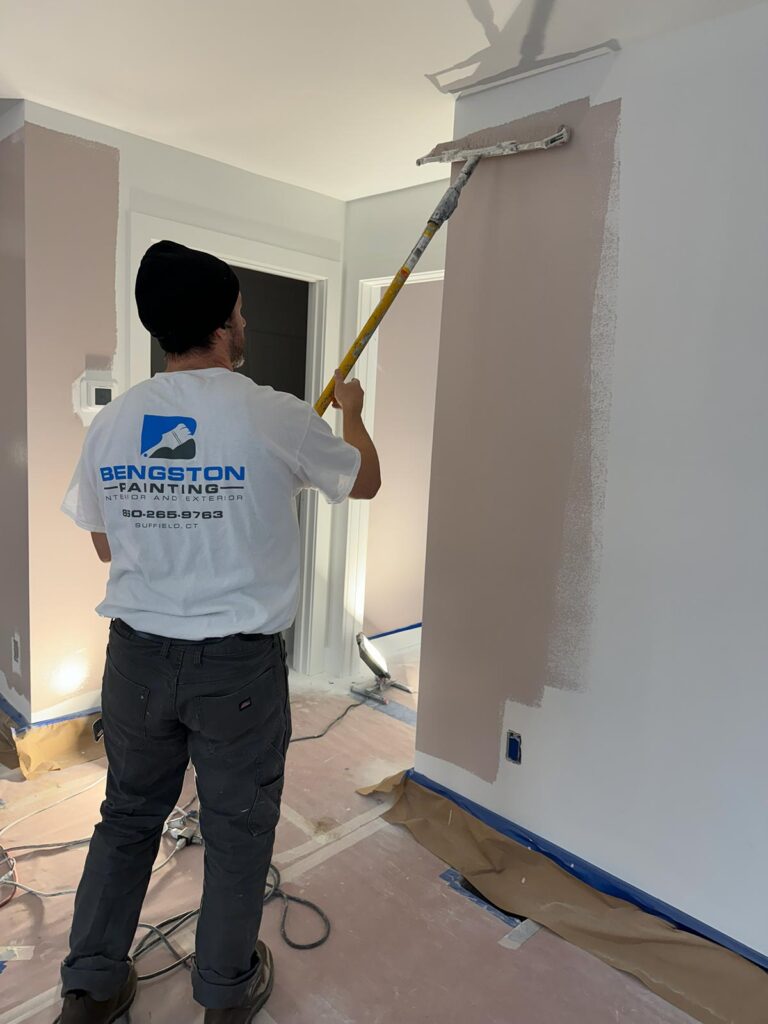 man painting wall